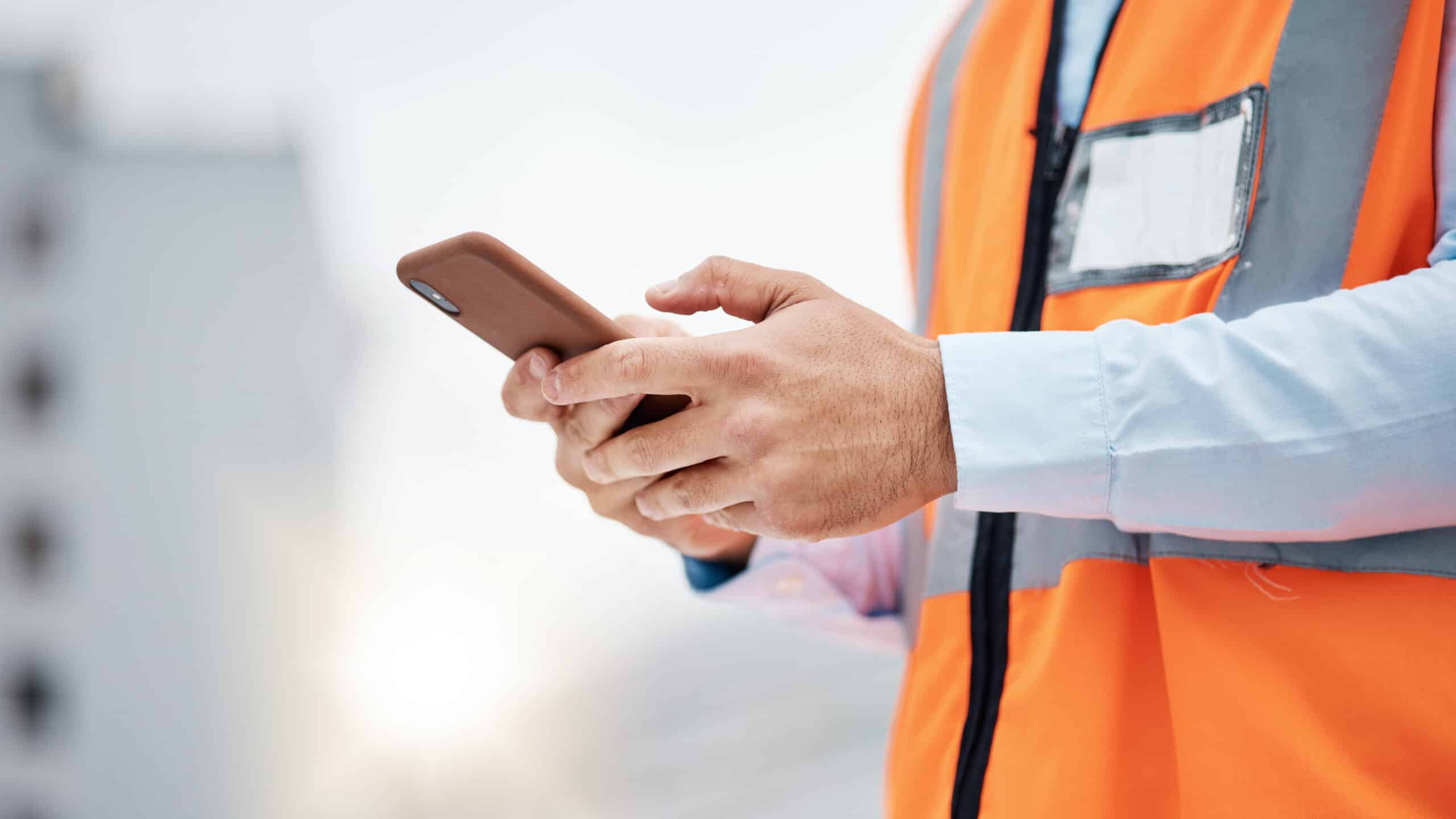 Phone Engineer at a Construction Site